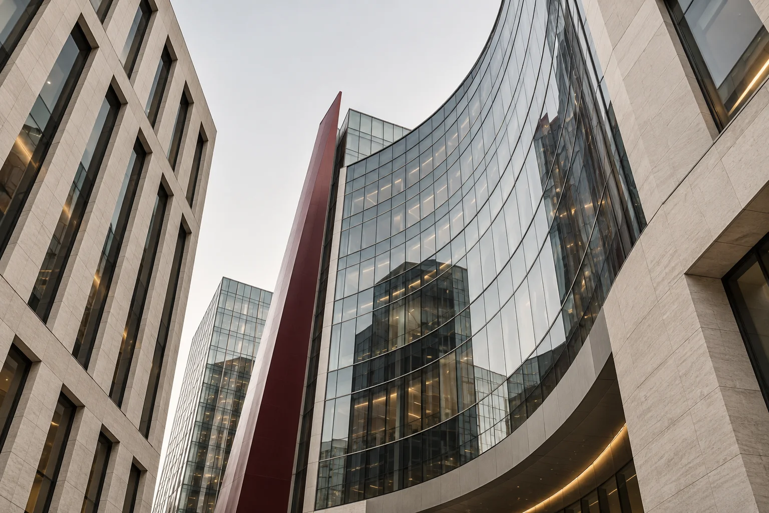 Contemporary glass office architecture viewed from a courtyard